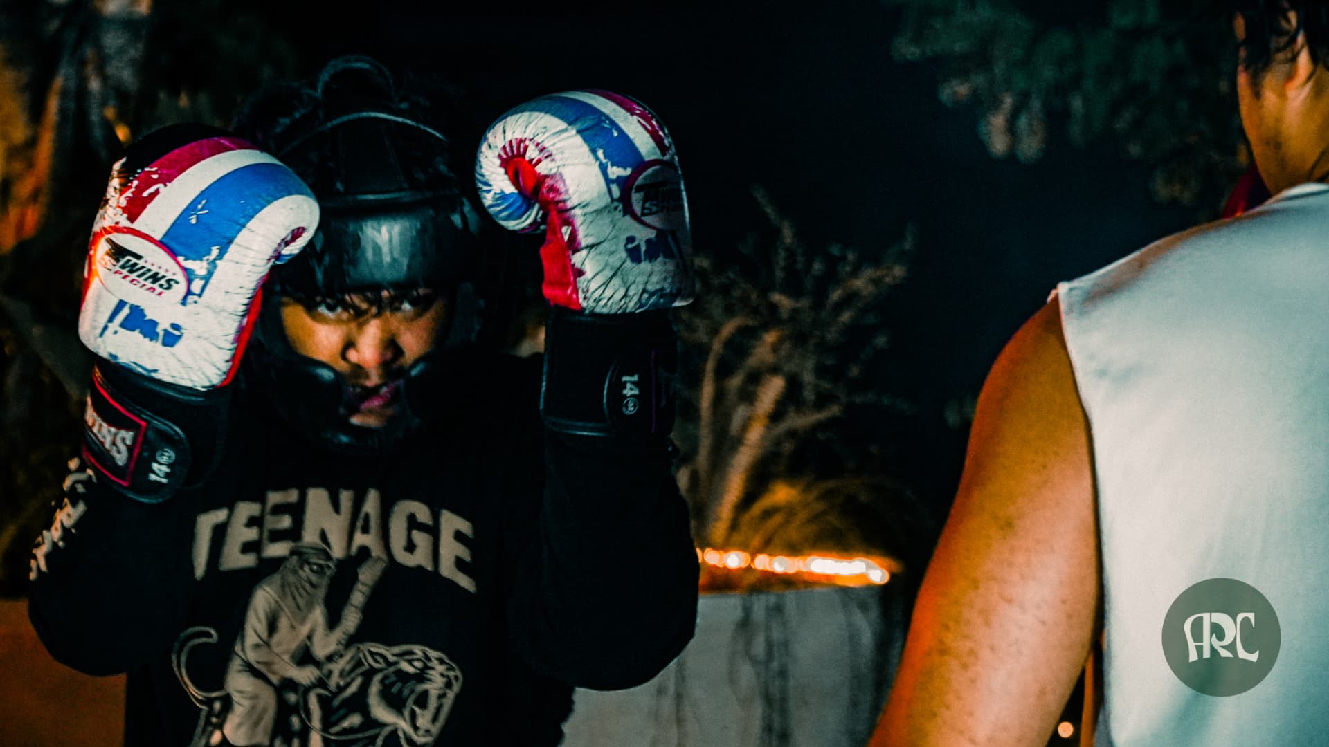 Two people sparring with boxing gloves at an ARC Fight Club session