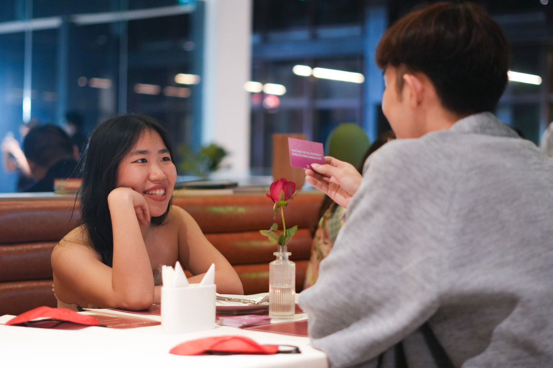 Two guests sharing a conversation card at a SPARC table