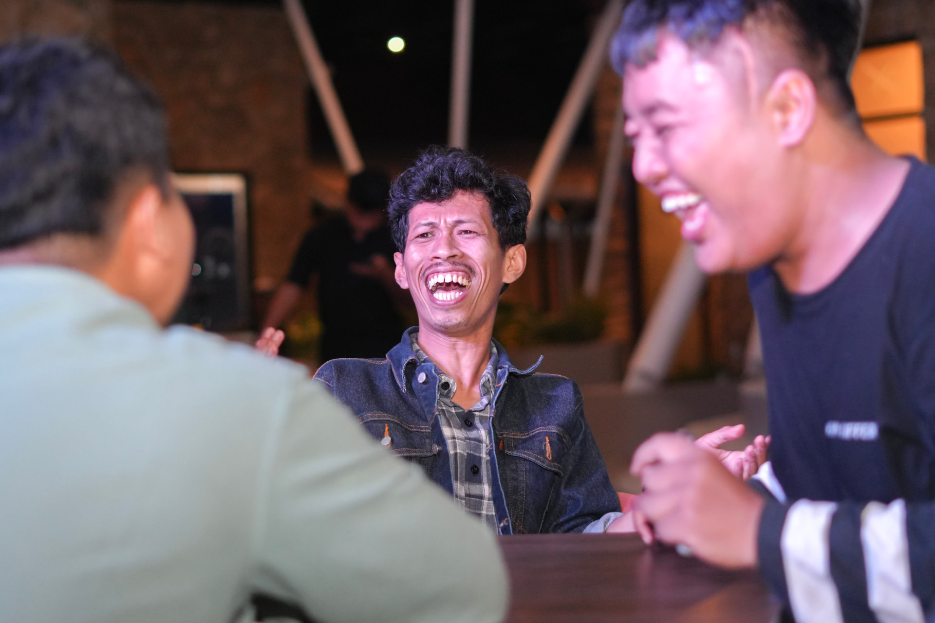 Players laughing together during a trivia round